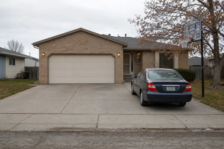 A house with an attached garage in Pueblo, CO