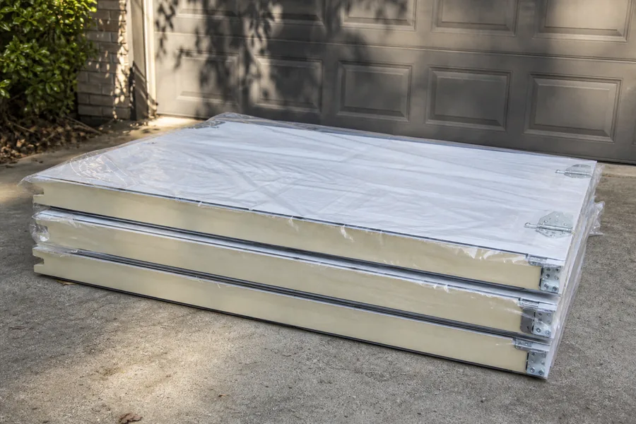 New insulated door sections on the driveway in Pueblo, CO