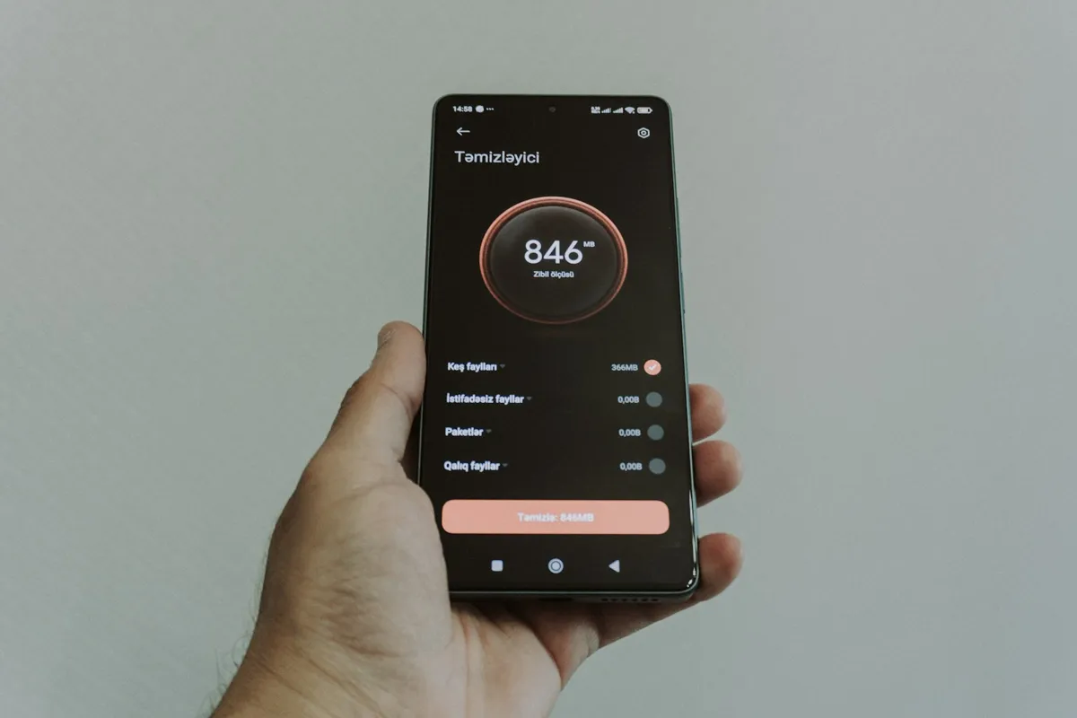 Hand holding a phone with a home app dial